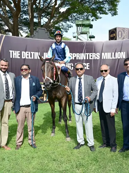 Trakila, winner of The Karnataka Sub-Area Cup, with jockey P. Trevor and the owners.