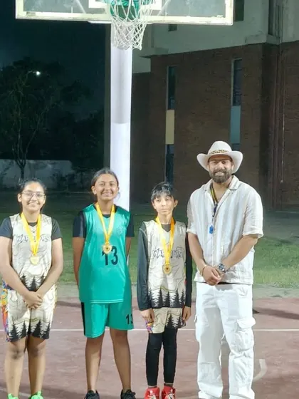 Another group of champions from the 3x3 tournament, posing under the lights.