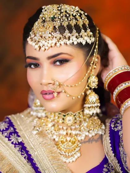 This close-up highlights the intricate matha patti and other jewelry. Our students learn how to apply makeup that enhances, rather than competes with, such elaborate accessories.
