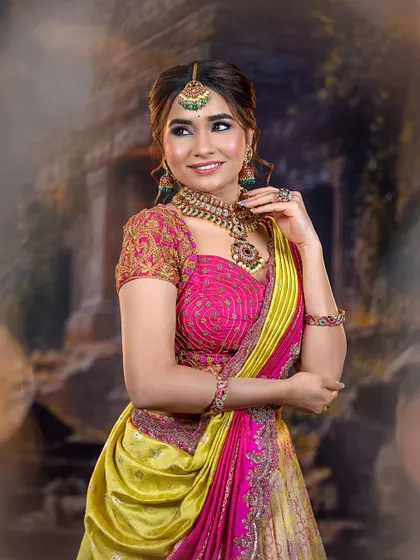 A smiling portrait of the model, showing how the makeup enhances her features naturally. The colors of the outfit are bright and festive.