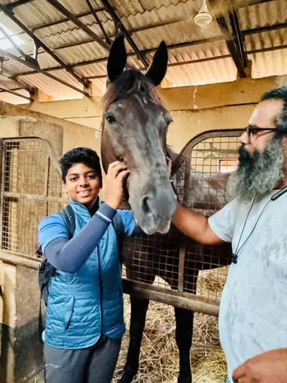 The perfect match is everything. We take great pride in finding the right horse for each rider's ambitions, creating a true partnership. This moment captures the excitement of a young rider meeting his new partner, Dreamboy.