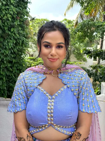 A close-up of the Mehendi makeup, featuring shimmery pink eyeshadow and glowing skin for a youthful and celebratory look.