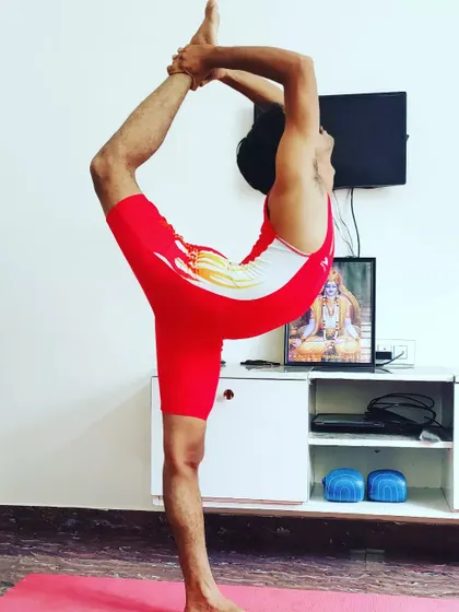 Holding Natarajasana during my personal practice at home. Consistent daily practice is essential to maintain and deepen these advanced postures.