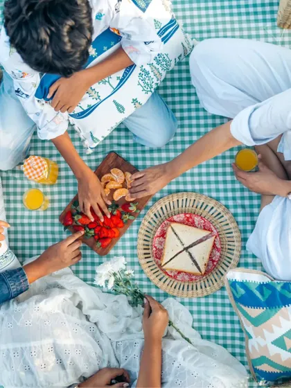 A top-down view of the picnic spread, surrounded by a variety of our cushion covers. It's all about creating a comfortable and beautiful setting for making memories.