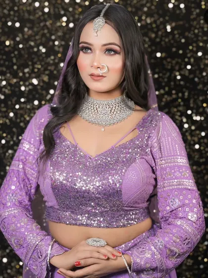 A unique lavender sequined outfit paired with a silver American Diamond choker and maang tikka. We can create modern jewellery to match any outfit colour.