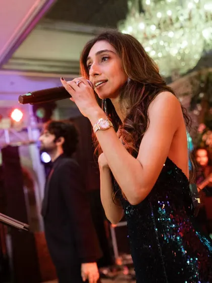 A candid moment captured during a performance at the Taj Mahal Palace, Mumbai. I love connecting with the music and the audience during a show.