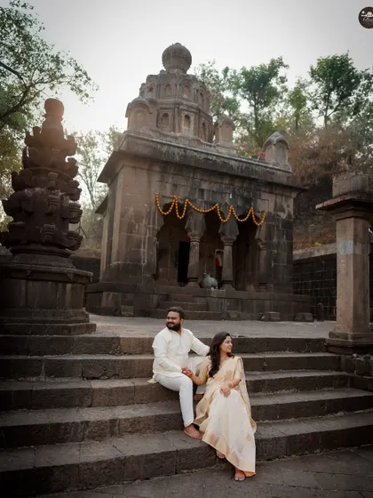 A quiet, candid moment during a traditional pre-wedding shoot at a heritage temple. I guide couples to interact naturally, capturing their connection against culturally rich and beautiful backdrops.