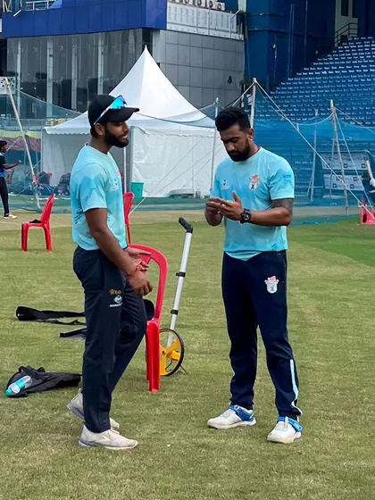 A conversation on the pitch. We are discussing field placements and game scenarios, connecting the physical preparation in the gym to the tactical demands of cricket.