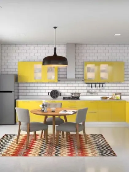 A sunny yellow L-shaped kitchen with a small dining nook, showing how to integrate a breakfast area even in a compact space.