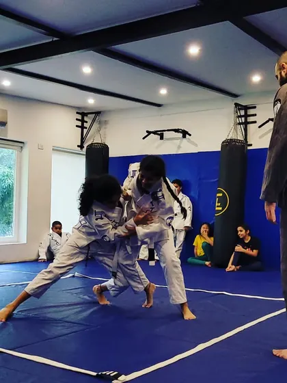 This is our kids' Jiu-Jitsu and grappling class in action. I'm teaching them how to use technique and leverage, not just strength. It's about control and thinking two steps ahead.