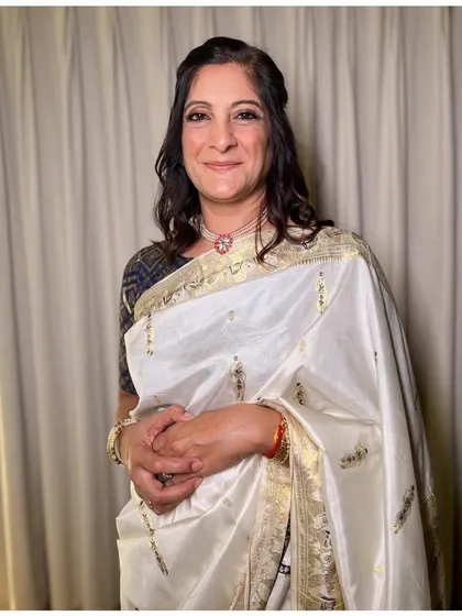 The beautiful mother of the bride, looking elegant and proud for her daughter's engagement.