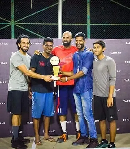 Another team receives their trophy at the Tarmak basketball tournament, highlighting the successful conclusion of the event we managed.