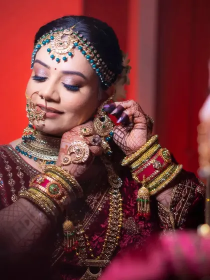 The final touches. A bride getting ready is a moment of calm and anticipation before the celebration begins.