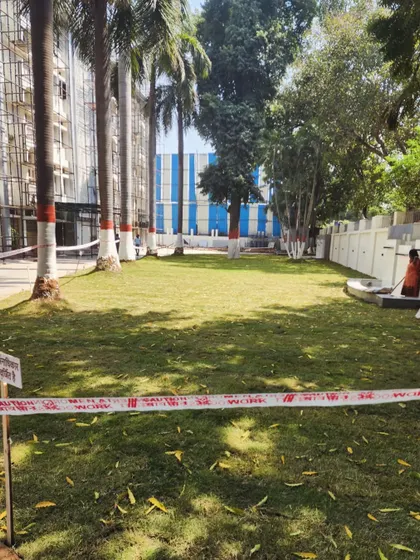 The completed lawn renovation at Bihar Bhawan, cordoned off to allow the new turf to establish itself. The space is already visibly greener and more inviting.