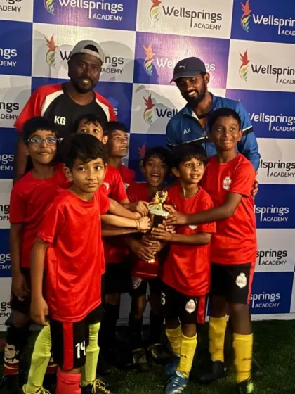 The youngest Rams, our U8 team, celebrating with their coaches after winning the Bronze Cup.