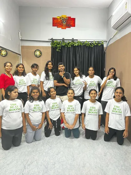 The full crew. A group photo of our students with their instructor, showcasing the large and happy family we have at The Beat Room.