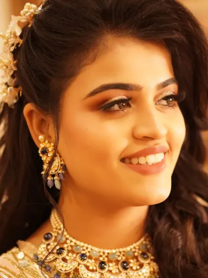 Explore more of my glamorous reception looks, featuring a variety of shimmering eye makeup, flawless finishes, and styles perfect for celebrating in the evening.