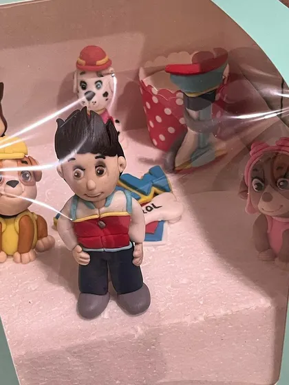 Another view of our handcrafted Paw Patrol fondant toppers before they were placed on the cupcakes. We love the challenge of creating detailed, recognizable characters for your themed parties.