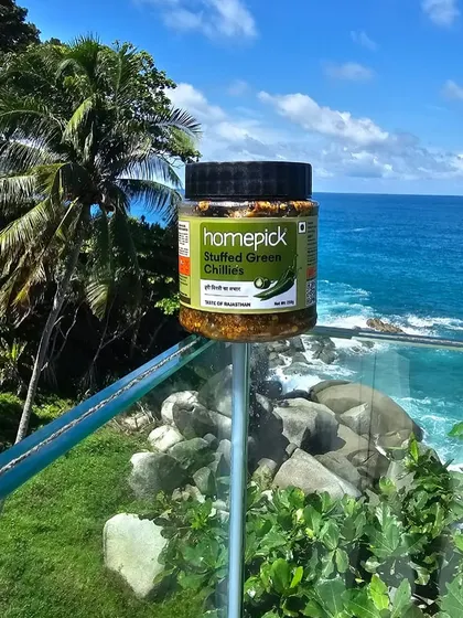A jar of our Stuffed Green Chillies enjoying a scenic view. It's proof that a good pickle can make any moment, and any location, feel a little more like home.