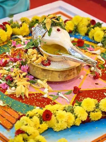 A beautifully decorated conch shell, a key element in the Maha Sudarshan Homa. This ritual invokes the energy of Lord Vishnu for protection and the removal of negativity.