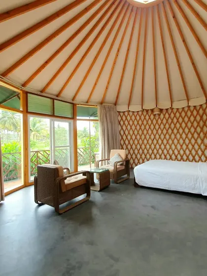 The unique circular design and tent-like roof of our riverside cottages offer a one-of-a-kind stay experience.