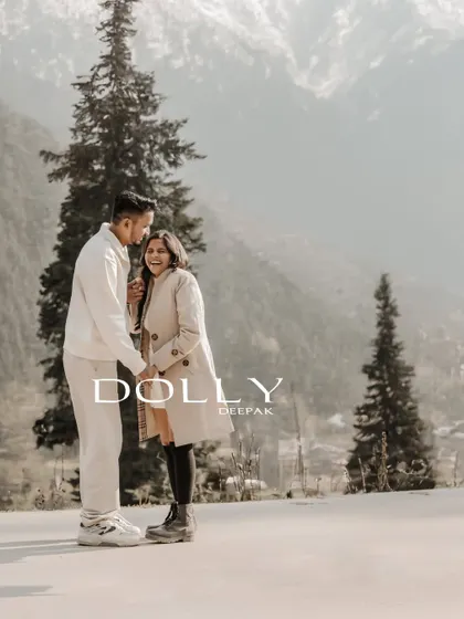 A serene pre-wedding portrait in Gulmarg, Kashmir, with the majestic snow-capped mountains providing a breathtaking backdrop.