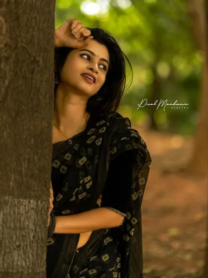 Using the tree as a natural frame, this close-up shot creates a sense of intimacy and mystery. The soft, diffused light in the woods is perfect for these kinds of expressive portraits.