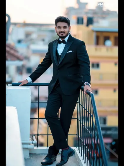 A stylish groom portrait on a rooftop, with the city in the background. We find cool, urban locations for modern wedding photography.