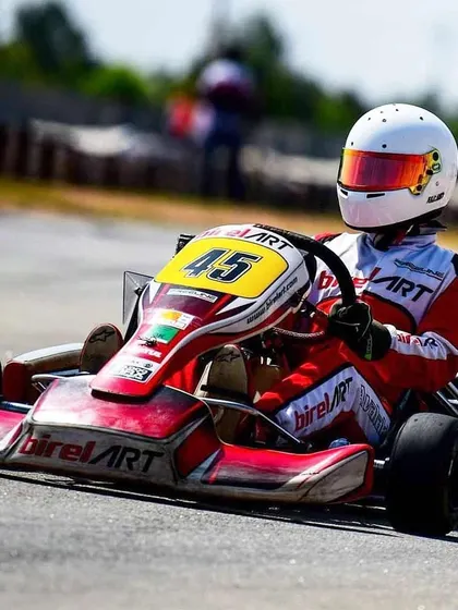 A close-up of Mihir Avalakki in kart 45, showcasing the control and precision that led to his 1st place finish in the Junior category.