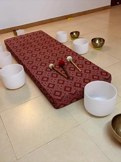 This is a typical setup for a sound healing session, featuring a mix of Tibetan and crystal singing bowls. My course empowers students to become confident teachers, ready to start their own studios with the right knowledge and tools.