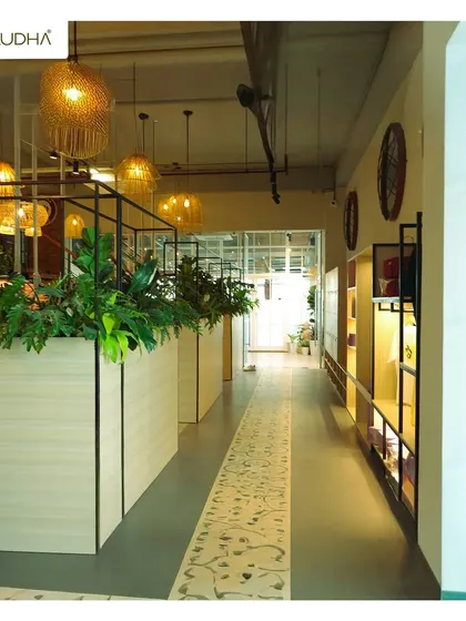 This long hallway in a commercial establishment is made interesting with design. I used large planters as dividers, a patterned floor runner to guide the eye, and warm lighting to create a journey rather than just a passage.