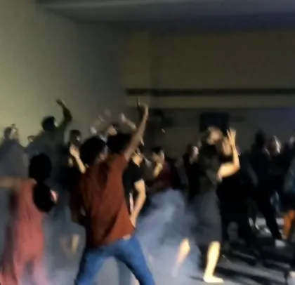 The dance floor is filled with smoke and energy at the Mathworks party.
