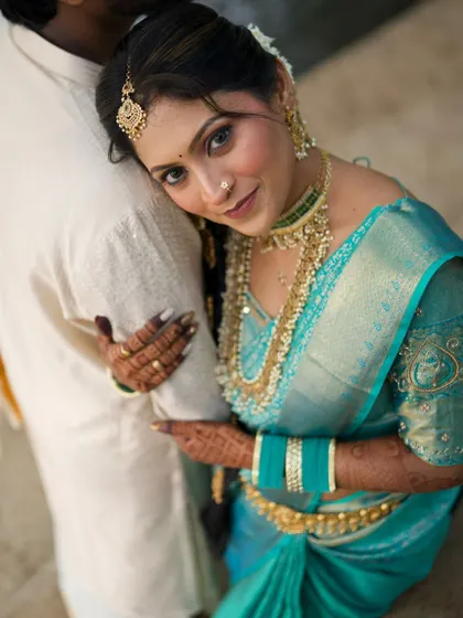 An intimate couple portrait. The bride looks stunning, and her traditional look is a beautiful contrast to the groom's simple white attire.
