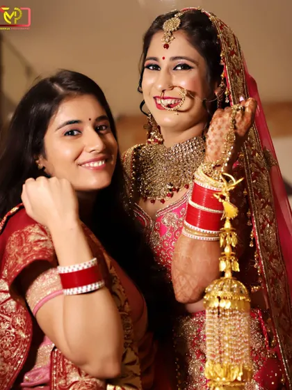 The bride sharing a happy moment with her sister or friend. Capturing these relationships and the joy of the day is a key part of my wedding photography.