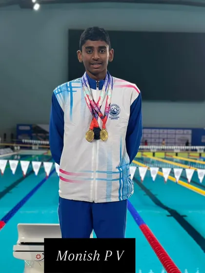 Monish P V proudly displaying his bronze medal from the Junior Nationals.