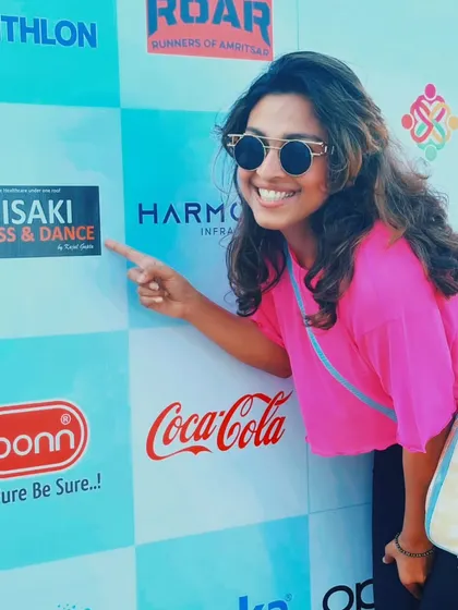 Proudly pointing to our logo as an event partner. We have a strong track record of successful collaborations with major brands and event organizers.