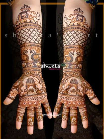 Symmetrical designs are my favorite. This piece features bold elephants at the top, with peacocks and architectural domes flowing down the hands for a royal look.