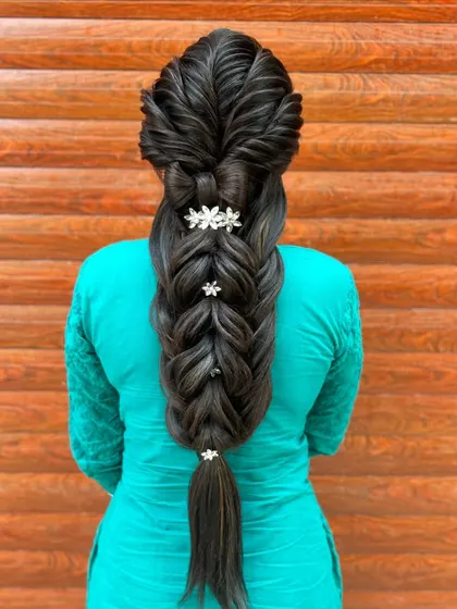 A full-length view of the five-strand braid, showing its impressive length and volume, achieved with proper technique and extension work.