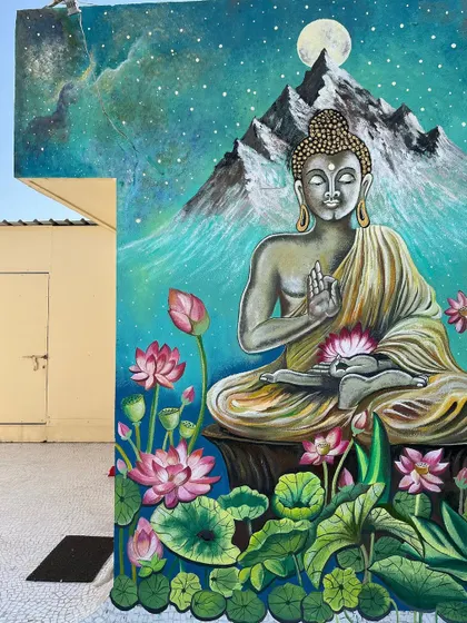 I painted this large Buddha mural for an open terrace in Ahmedabad, creating a peaceful lounge vibe. The galaxy background and lotus flowers give it a scenic, meditative quality.