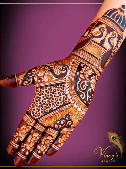 A beautiful design featuring peacocks and architectural elements, offering full coverage for the palm in a stylish way.
