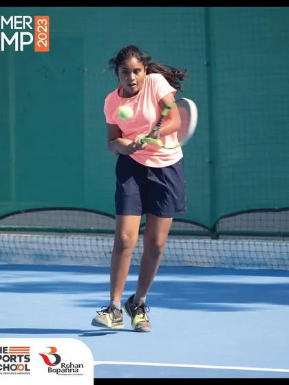 A female player prepares to hit a forehand during a Summer Camp session. Our camps are open to all, providing a supportive and encouraging environment for girls and boys to develop their skills.
