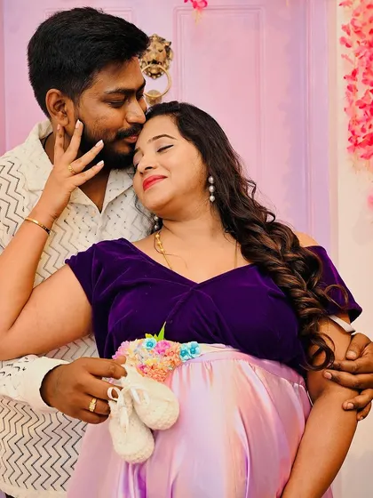 A close up, tender moment between an expecting couple. The tiny baby shoes are a sweet prop that adds a layer of emotion and anticipation to the photograph.