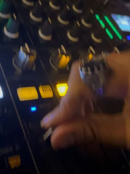 A close up of my hand working the mixer, a key part of the live performance.