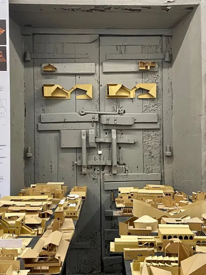 Physical models, like these from a student workshop, are essential tools for understanding three-dimensional space. They make the architectural idea tangible, showing how different forms come together to create a whole.
