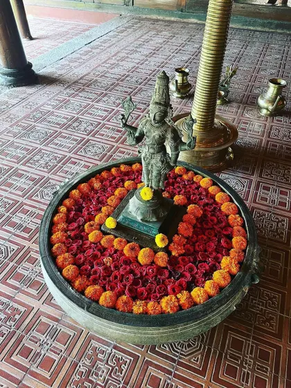 A guest shares her feeling of being renewed, refreshed, and rejuvenated after a 3.5-week Panchakarma retreat with us, captured in this photo of a traditional floral arrangement.
