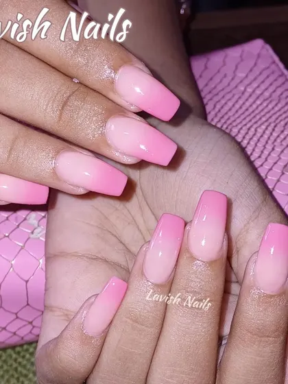A beautiful pink ombre on square nails, blending from a natural nude to a bright, cheerful pink.