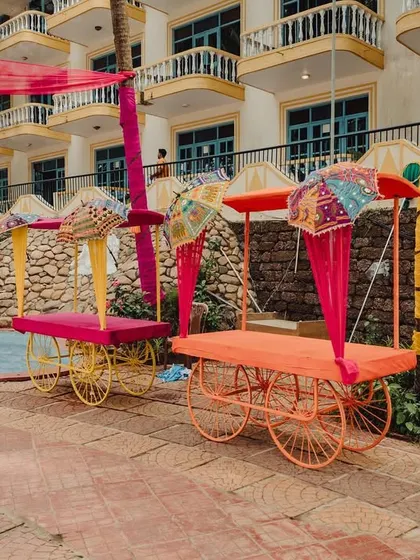 We used these colorful, customized carts as fun seating and prop elements for a Haldi Carnival, adding a unique and playful touch to the poolside decor.