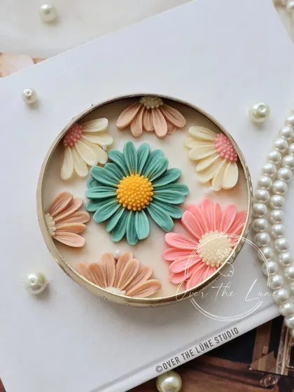 Another one of my new Daisy Urli designs, this one with a soft, earthy palette of teal, pink, and beige. Each one is unique and brings a gentle, floral touch to your space.