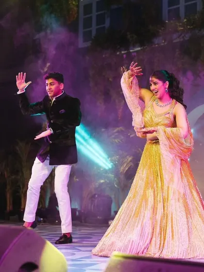 A sibling duo performance, perfectly choreographed and full of energy, adding another layer of fun to the Sangeet night.