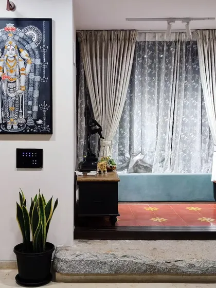 A single snake plant in a classic black pot complements the traditional decor of this home, adding a touch of nature without overwhelming the space.